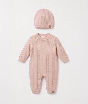 Blush cable knit baby romper with matching beanie luxury newborn knit outfit perfect for special occasions