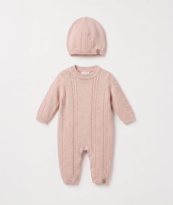 Blush cable knit baby romper with matching beanie luxury newborn knit outfit perfect for special occasions