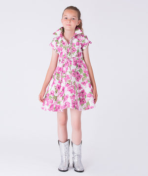 Luxury bougainvillea floral girls occasion dress worn by a 7-year-old girl, featuring crystal accents, sleeveless silhouette and softly flared skirt for weddings and special occasions.