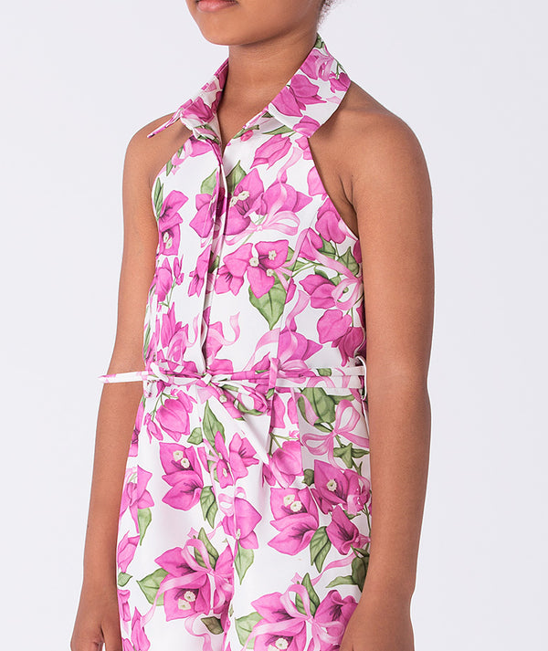 Close-up of bougainvillea floral print and halter neckline on a girls jumper, highlighting lightweight fabric and refined detailing.