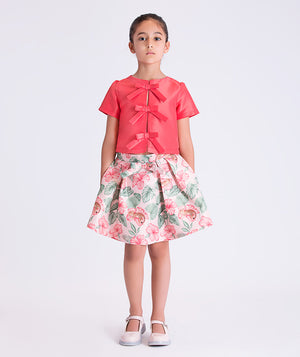 Front view of the Bow Enchanted Girls Outfit featuring a bow-detail short-sleeve top and floral skirt, crafted from premium lightweight fabric with cotton lining, designed for girls ages 3–12 for birthdays and special occasions.