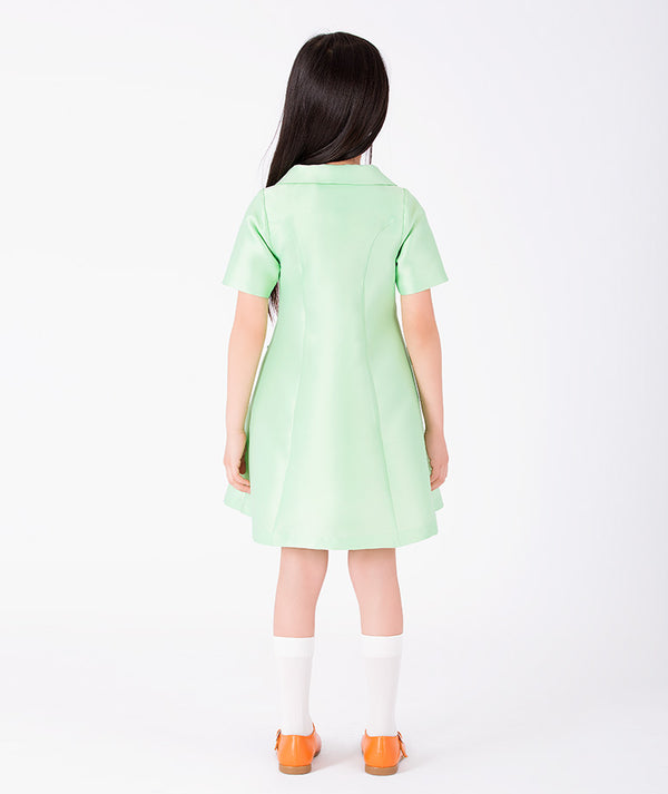 Back view of Button-Front Girls Twill Dress in mint green for girls ages 3 to 12, showing the silhouette and refined construction