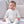 Charger l'image dans la galerie, Baby portrait showcasing soft knit baby clothing and accessories.
