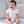 Carica l'immagine nel visualizzatore Galleria, Baby in soft knitwear, photographed for a baby clothing editorial.
