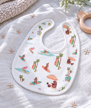 Beach-print baby bib, baby feeding accessory for everyday use.