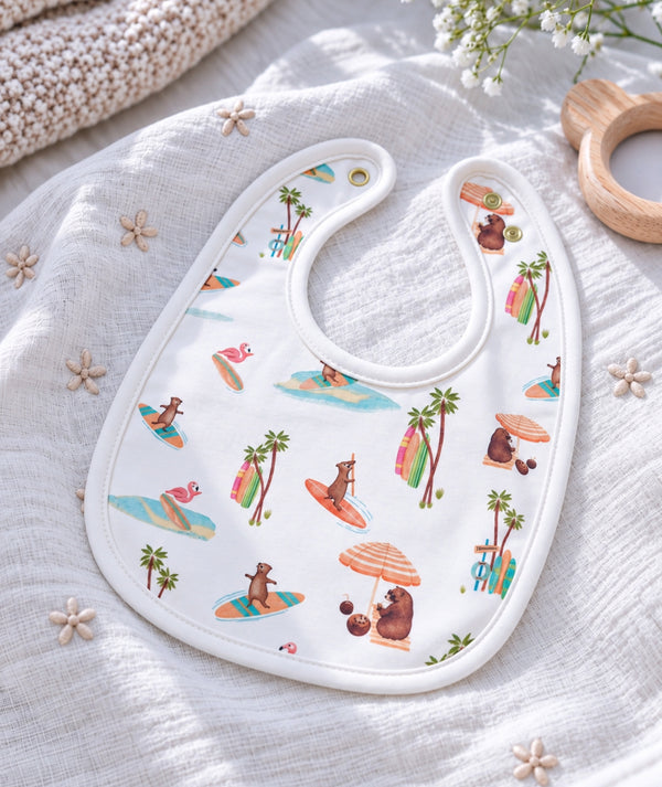 Beach-print baby bib, baby feeding accessory for everyday use.