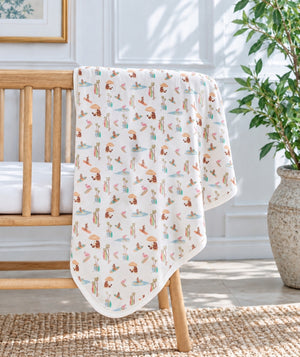 Beach-print baby blanket, soft nursery and gifting accessory.
