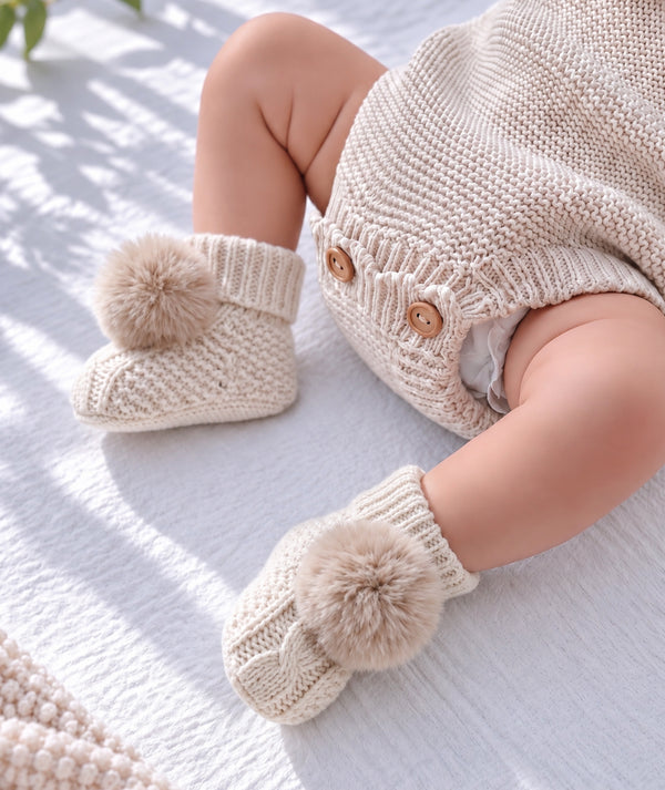 Cream puff baby booties, soft newborn footwear and baby gift accessory.