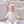 Carica l'immagine nel visualizzatore Galleria, Baby portrait featuring a soft knitted bonnet and cozy baby clothing.
