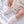 Charger l'image dans la galerie, White baby booties, soft knitted footwear for newborn outfits.
