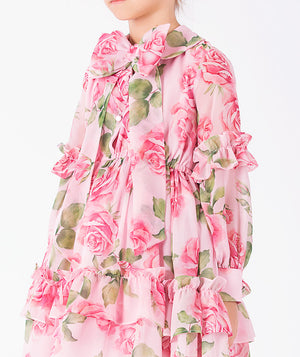 Editorial view of Chiffon Layers Rose Girls Dress in pink chiffon for girls ages 3 to 12, featuring fabric texture and color