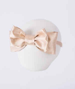 Classic gold bow headband for girls with structured metallic finish, elegant ceremony hair accessory from Golden Amara Collection