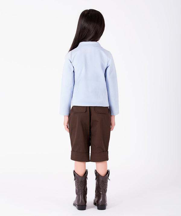 Back view of Classic Plaid Girls Bow Outfit with powder-blue collared top and chocolate tailored shorts for girls ages 3 to 12 by Mama Luma.