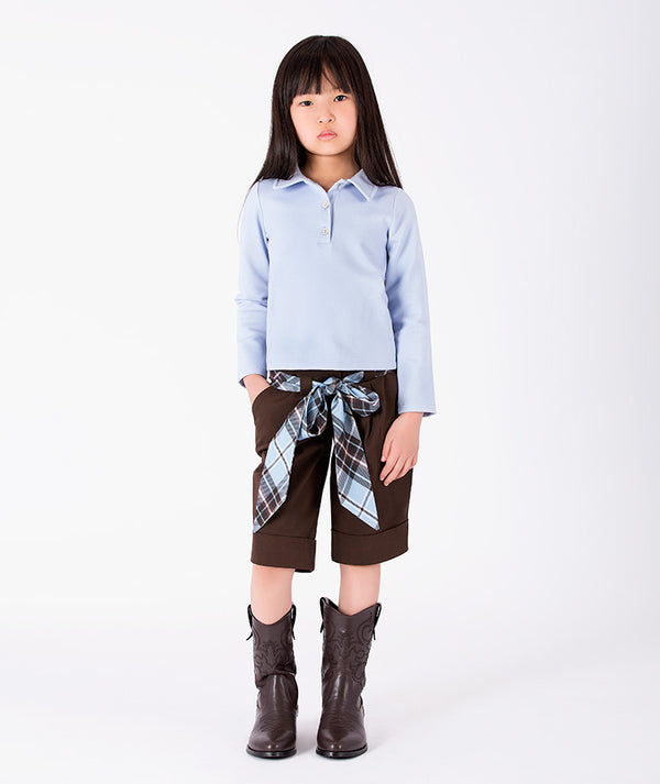Front view of Classic Plaid Girls Bow Outfit with collared blue top, tailored chocolate shorts and plaid bow for girls ages 3 to 12 by Mama Luma.
