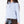 Load image into Gallery viewer, Detail view of Classic Plaid Girls Bow Outfit featuring a powder-blue top, chocolate shorts and blue plaid waist bow by Mama Luma.
