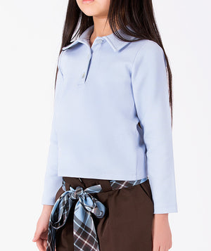 Detail view of Classic Plaid Girls Bow Outfit featuring a powder-blue top, chocolate shorts and blue plaid waist bow by Mama Luma.