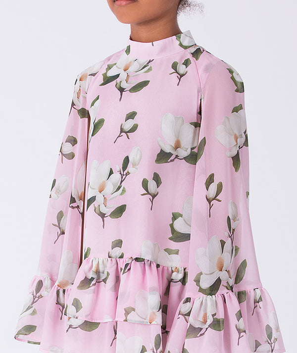 Close-up of Mama Luma girls floral dress highlighting the layered sleeve detail, smooth fabric texture, and floral pattern, designed for elegant events, sizes 3–12