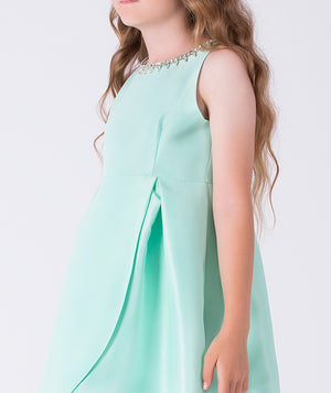 Mint green dress with a beaded neckline on a white background