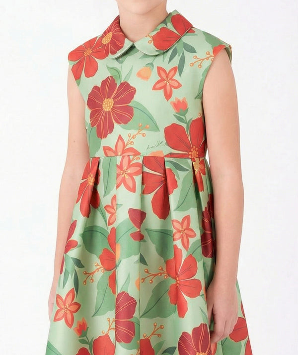Close-up of Coral Botanical Girls Dress in mint green for girls ages 3 to 12, highlighting fabric texture and designer details