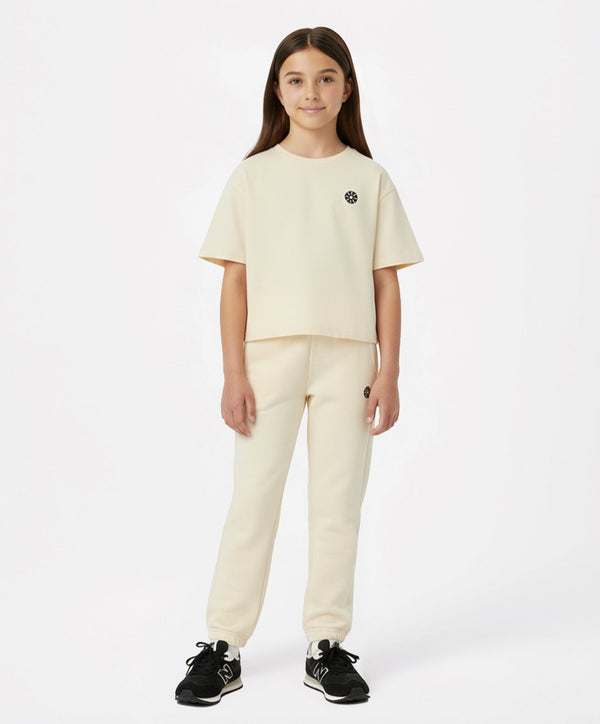 Girls cream short-sleeve active t-shirt and jogger set, designed for school days, playground fun, weekend outings, and sports activities, available in sizes 3–14Y.
