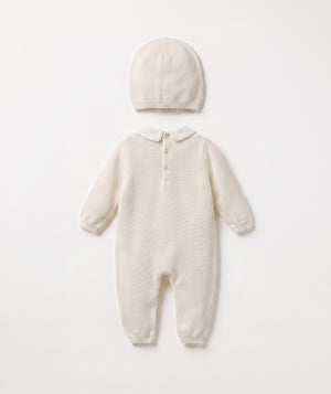 Ivory bow knit baby romper with matching beanie luxury baby outfit with Peter Pan collar perfect for special occasions