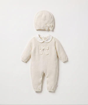 Ivory bow knit baby romper with matching beanie luxury baby outfit with Peter Pan collar perfect for special occasions
