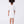 Load image into Gallery viewer, Back view of a white girls occasion dress featuring crystal shoulder details and a straight-cut silhouette for refined celebrations
