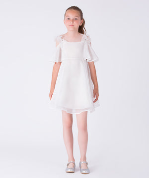 Crystal flower strap girls dress in soft white with sheer fabric, flutter sleeves and a gently flared silhouette for elegant occasions
