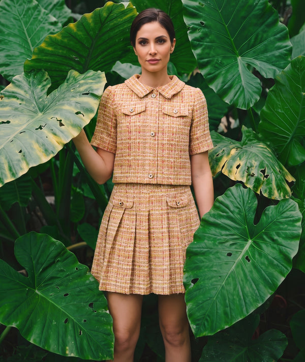 Crystal Tweed Women's Outfit from Mama Luma styled in a tropical garden, featuring warm-toned tweed and crystal-inspired buttons.