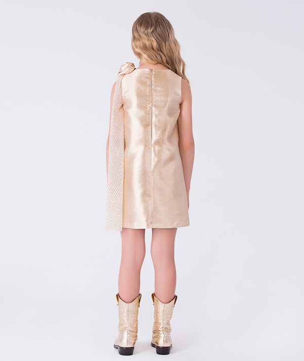 Back view of gold straight-cut girls dress with concealed zipper and elegant shoulder overlay detail.