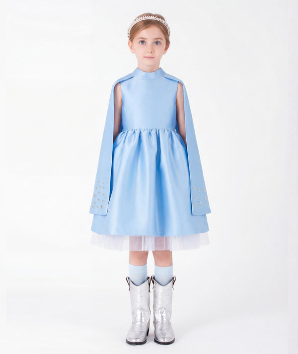 Ice blue satin girls cape dress with crystal embellished cuffs and tulle hem front view