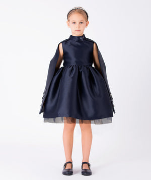 Front view of Diamond-Embellished Girls Cape Dress in navy tulle for girls ages 3 to 12, a premium children’s design by Mama Luma