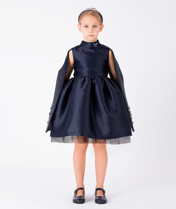 Front view of Diamond-Embellished Girls Cape Dress in navy tulle for girls ages 3 to 12, a premium children’s design by Mama Luma