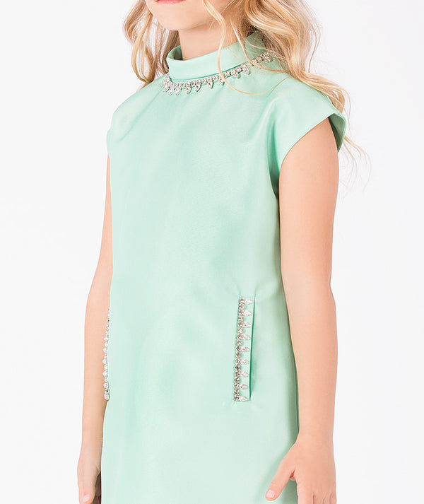 Close-up of Diamond Neckline Girls Dress for girls ages 3 to 12, highlighting fabric texture and designer details
