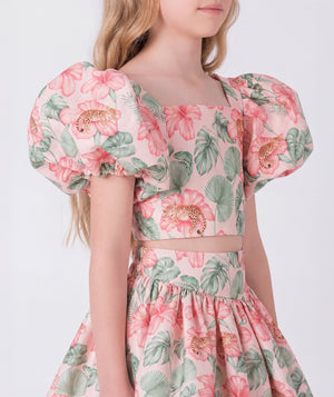 Close up view of the Puff Sleeve High-Low Skirt Outfit featuring a puff-sleeve top with zip closure and a flowing high-low floral skirt made from breathable lightweight fabric, designed for girls ages 3–12 for Eid celebrations and garden events.
