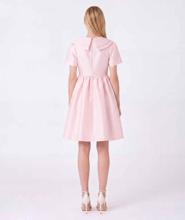Back view of Enchanting Brooch Women's Dress in pink cotton, highlighting neckline, sleeves and embellishments