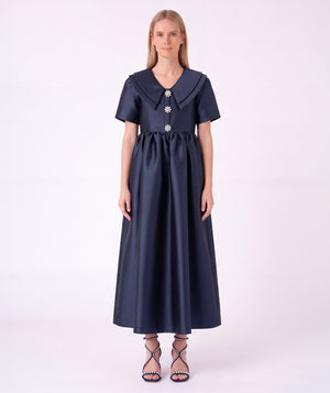 Front view of the Enchanting Brooch Women’s Dress from Mama Luma’s Suva Maia Collection, featuring three crystal floral brooches and a layered collar.