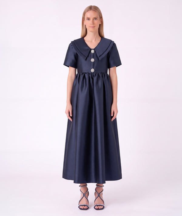 Front view of the Enchanting Brooch Women’s Dress from Mama Luma’s Suva Maia Collection, featuring three crystal floral brooches and a layered collar.