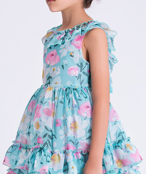 Close-up of Enchanting Chiffon Girls Dress showing lightweight chiffon fabric, floral print, and ruffled shoulder detail.