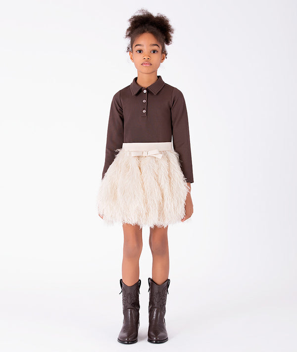 Front view of Enchanting Feathers Girls Outfit with chocolate polo-inspired top and voluminous ivory feather skirt for girls ages 3 to 12 by Mama Luma.