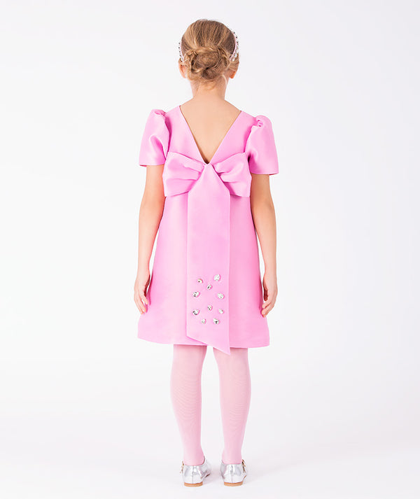 Enchanting pink girls dress with oversized back bow and crystal embellishments
