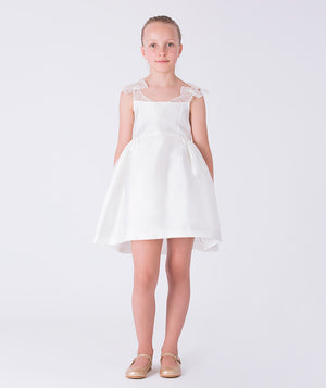 Front view of ivory Exquisite Bow Girls Dress with embellished sheer straps and flared A-line skirt.