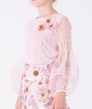 Close-up detail of Exquisite Flowers girls blouse in pink organza with sheer sleeves and delicate craftsmanship, styled for elegant celebrations (3–12Y)