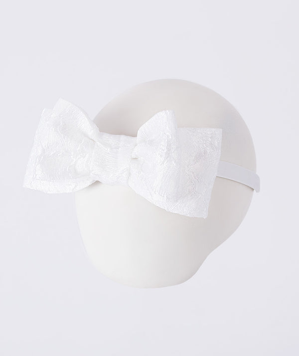Exquisite jacquard bow headband with oversized woven bow, designed to complement girls’ special occasion outfits with elegant detail.