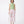 Carica l'immagine nel visualizzatore Galleria, Woman wearing a light green top and pink floral skirt on a white background
