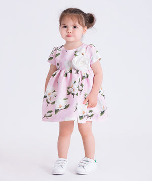 Pink floral baby dress featuring a 3D flower appliqué, by Mama Luma