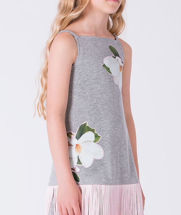 Close-up of floral appliqué detail on sleeveless fringe girls dress by Mama Luma, elegant floral occasion dress for girls