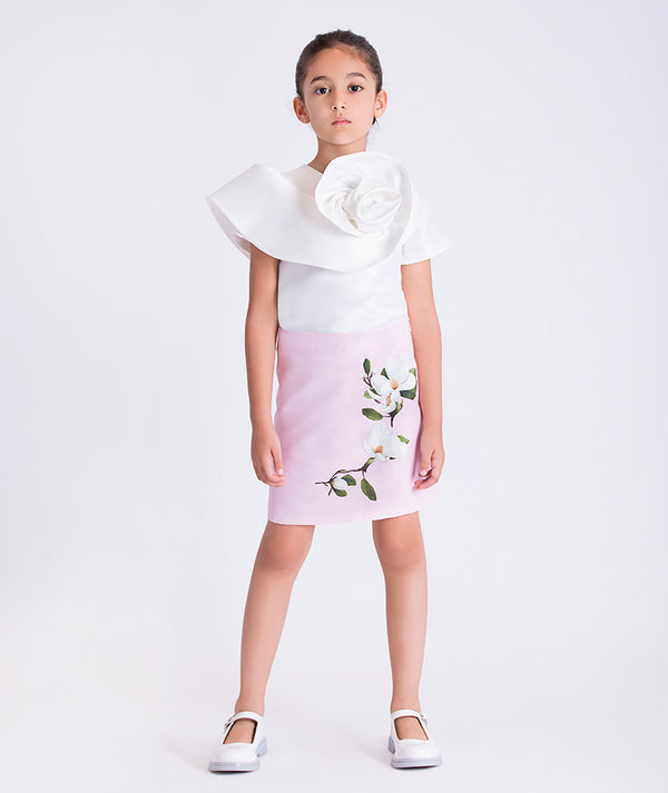 Floral appliqué girls outfit featuring a sculptural top with 3D flower detail and matching skirt, two-piece set by Mama Luma