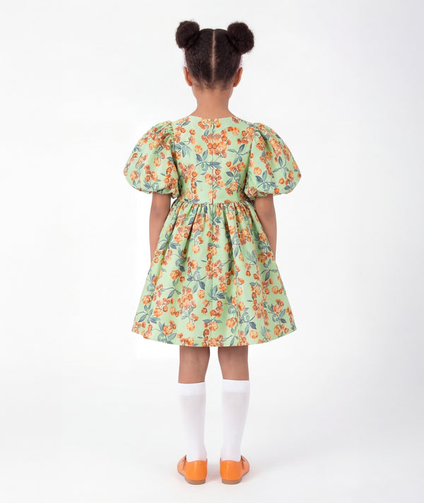 Back view of Floral Balloon Sleeve Girls Dress in mint green for girls ages 3 to 12, showing the silhouette and refined construction