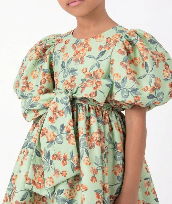 Close-up of Floral Balloon Sleeve Girls Dress in mint green for girls ages 3 to 12, highlighting fabric texture and designer details